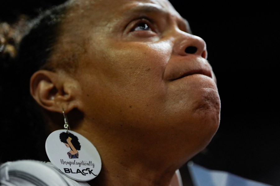 FILE - A supporter wearing earrings that read "Unapologetically Black" listens during a campaign rally for Democratic presidential nominee Vice President Kamala Harris, Aug. 10, 2024, in Las Vegas. (AP Photo/Julia Nikhinson, File)