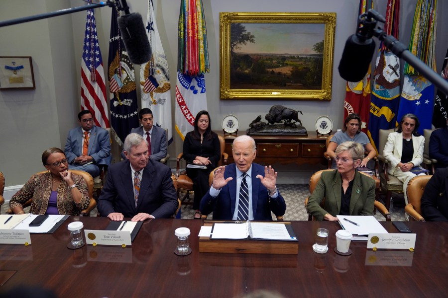 President Joe Biden delivers remarks on the federal government's response to Hurricane Helene and preparations for Hurricane Milton in the Roosevelt Room of the White House, Tuesday, Oct. 8, 2024, in Washington, as from seated left, Acting Secretary of Housing and Urban Development Adrianne Todman, Secretary of Agriculture Tom Vilsack, Biden, and Secretary of Energy Jennifer Granholm, right, look on. (AP Photo/Evan Vucci)