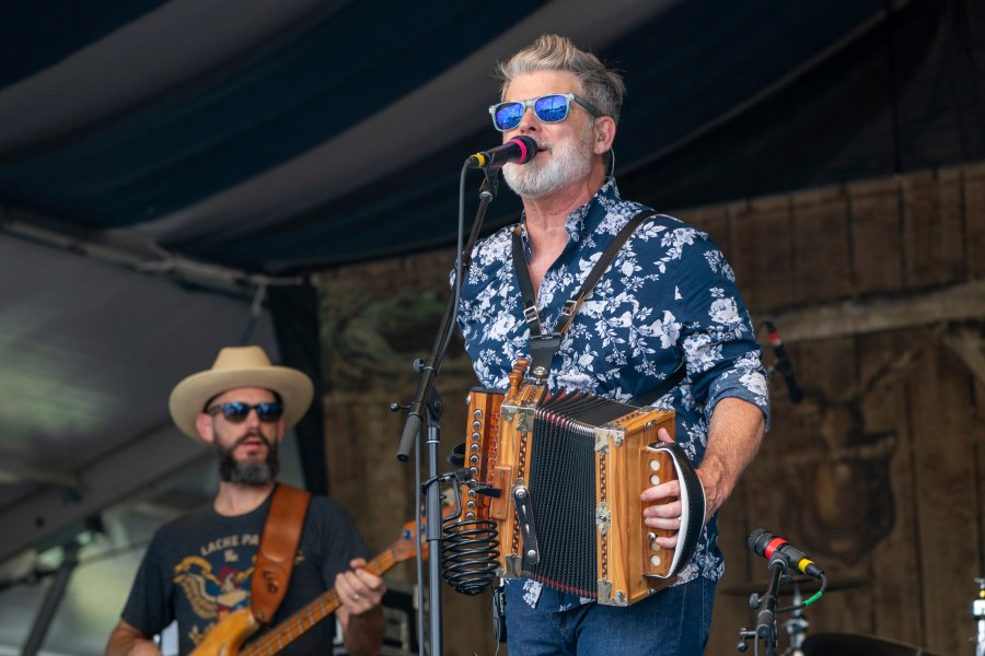 FILE - Steve Riley of Steve Riley and the Mamou Playboys performs during the New Orleans Jazz & Heritage Festival Saturday, May 4, 2024, at the Fair Grounds Race Course in New Orleans. (Photo by Amy Harris/Invision/AP, File)