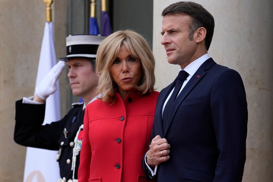 FILE - French President Emmanuel Macron and his wife Brigitte Macron wait for China's President Xi Jinping and his wife Peng Liyuan at the Elysee Palace, Monday, May 6, 2024 in Paris. (AP Photo/Thibault Camus, File)