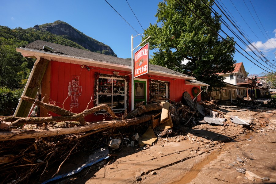 Businesses are seen in a debris field in the aftermath of Hurricane Helene, Wednesday, Oct. 2, 2024, in Chimney Rock Village, N.C. (AP Photo/Mike Stewart)