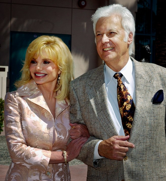 FILE - Loni Anderson and Jack Jones arrive for "The Bob Hope Memorial Tribute" show at the Academy of Television Arts and Sciences headquarters in Los Angeles' North Hollywood area Wednesday, Aug. 27, 2003. Jack Jones, a Grammy-winning crooner known for “The Love Boat” television show theme song, has died, Wednesday, Oct. 23, 2024. (AP Photo/Reed Saxon, File)