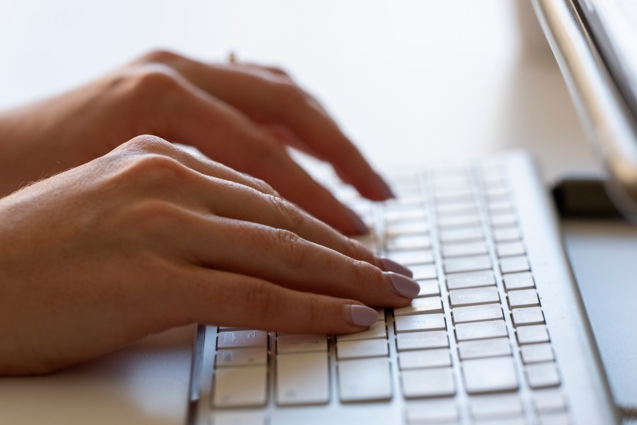 FILE - A person types on a keyboard on June 6, 2024, in Portland, Ore. (AP Photo/Jenny Kane, File)